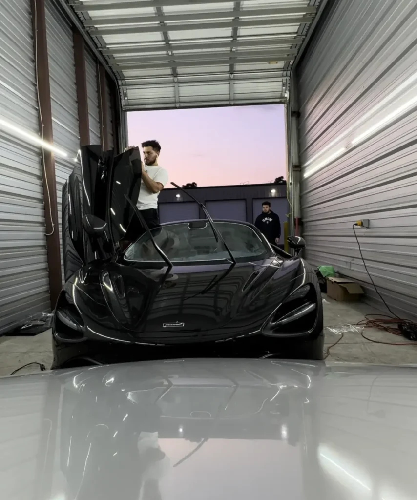 Technician Installing your vehicle's interior with window tinting by by NVS Customs services in Wilmington, NC