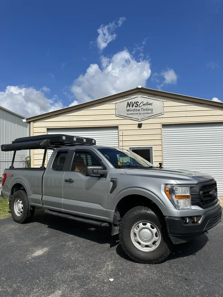 Ford and BMW vehicle with carbon window tinting by NVS Customs in Wilmington, NC